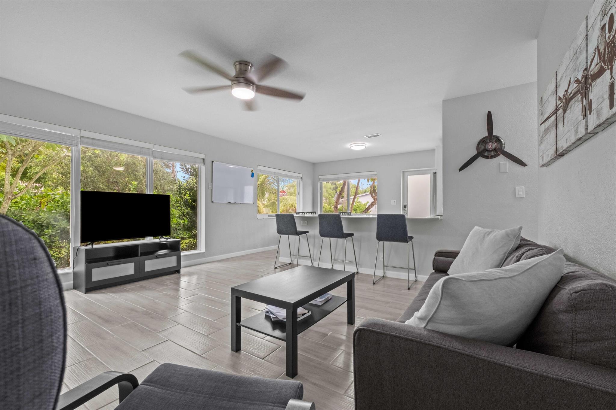 Spacious and renovated 3 bed / 2 bath Duplex in East Pompano Beach! Live just 2.5 miles from the beach in this beautifully updated unit. Features include hurricane-rated impact doors and windows, updated appliances, central A/C, in-unit washer & dryer, and two dedicated parking spaces. Enjoy a bright open layout, stylish finishes, and a prime location close to shopping, dining, and more.Currently furnished, but available either furnished ($3,350/month) or unfurnished ($3,100/month). Furniture can be removed prior to move-in.
