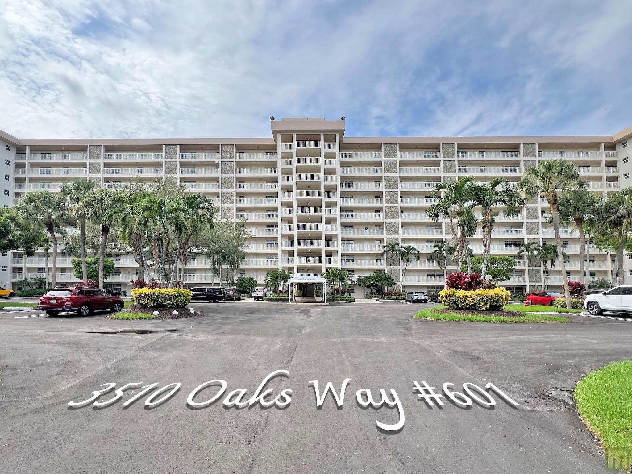 Beautifully updated sixth floor corner unit condo in Palm Aire's highly sought after Oaks Way location. High-end finishes throughout, wood shaker cabinets in the kitchen and bathrooms, matching granite countertops / vanity tops, stainless steel appliances, washer / dryer in-unit, high-impact windows & doors, plantation shutters, gorgeous wood flooring in the main living space, fantastic golf and lake views from the fully-screened balcony. Secure Lobby with fob / phone access and a short walk to the closest clubhouse and pool. The third bedroom has been opened up to the living area as a den but can easily be converted back but why would you? It's perfect! Quiet, clean community close to shopping and a short drive to the new casino! HOA is $1,022/mo & includes water, basic cable & internet!