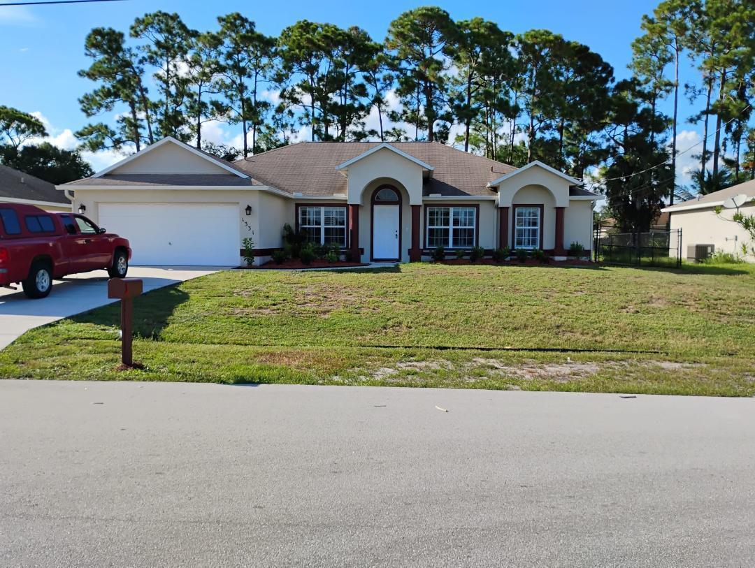 3/2/2 +DEN. IN GREAT LOCATION, OFF SAVONA. CLOSE TO WALMART, TRADITION, I-95, TURNPIKE & METS STADIUM. OPEN FLOOR PLAN FEATURES 2 FULL BATHS (new faucets in both & new toilets in both) A FORMAL DINING ROOM, DEN, FAMILY ROOM, BREAKFAST NOOK AND LAUNDRY ROOM. KITCHEN HAS DOUBLE SINK WITH CORIAN COUNTERS (new faucet) + PANTRY. ENTIRE INTERIOR, FRESHLY PAINTED!NEW LAMINATE FLOORING. NEW A/C 7/25. ORIGINAL ROOF, HOWEVER, NO LEAK HISTORY. 4-POINT INSPECTION 8-25 STATES THE ROOF HAS 5 REMAINING YEARS OF LIFE. SLIDERS TO THE BEAUTIFUL ENCLOSED POOL & PATIO. HOME HAS A FENCE & NEW LANDSCAPE.