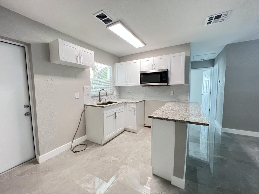 Photo of 3380 E Atlantic Drive, Boynton Beach, FL 33435 (MLS # R11155010)