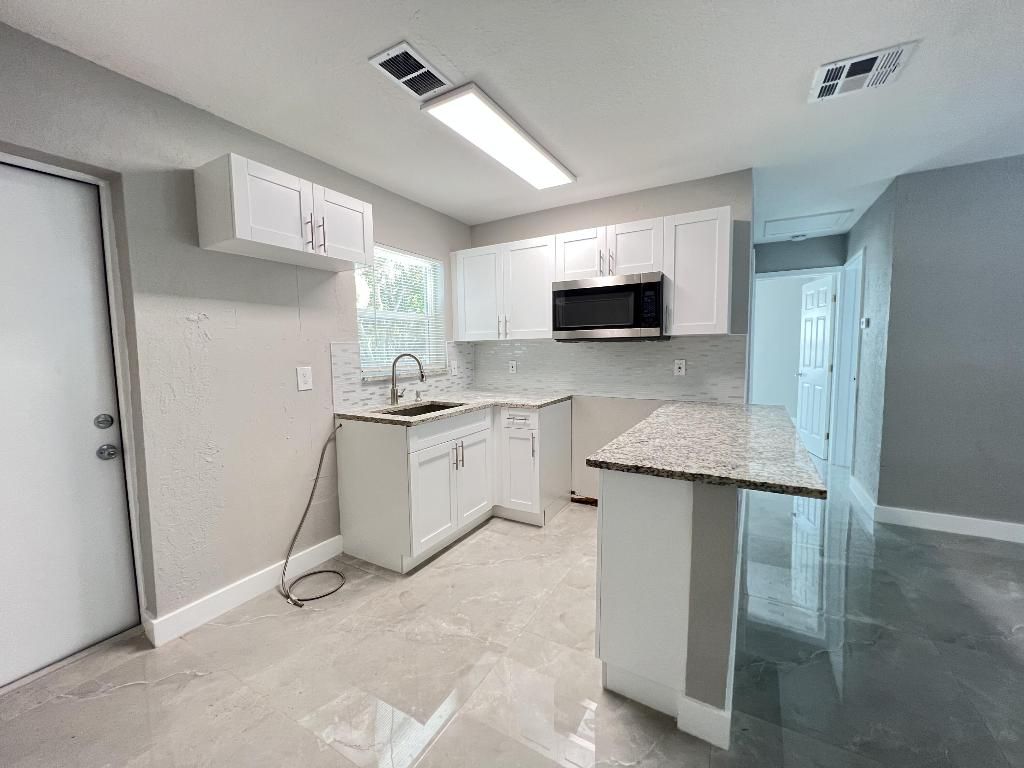 Photo of 3380 E Atlantic Drive, Boynton Beach, FL 33435 (MLS # R11155010)