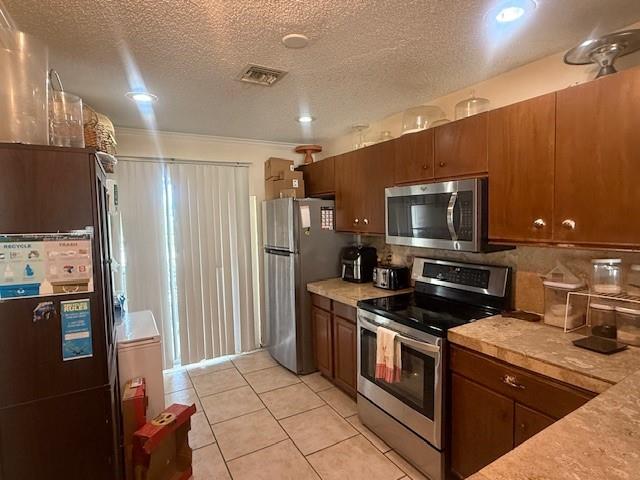 Location! Location! Location! This property has it all! 2 bedrooms, 2 1/2 bathrooms, two suites, laundry room with washer/ dryer, open kitchen and fenced in patio for entertaining. 2 parking spaces in front of the unit and plenty guest parking. This complex is close to everything you need. Don't miss it!!!
