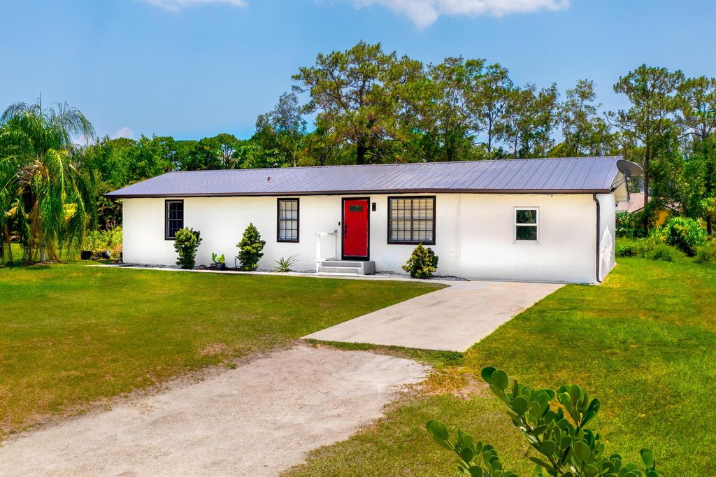 Photo of 12228 61st Lane N, West Palm Beach, FL 33412 (MLS # R11000442)