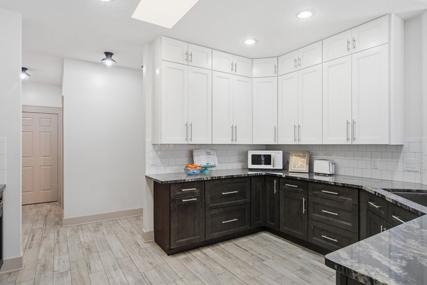 Welcome to your forever home in the pristine, gated enclave of Southern Oak Estates, where cookie-cutter simply doesn't exist. With just 33 custom homes tucked behind the gates and estate-sized lots ranging from ½ to 1 acre, this is a community where homes rarely come available and when they do, they move quickly. The HOA is only $50 per month, solely to maintain the gated entrance, preserving both privacy and value. This home sits on a nearly ½-acre corner lot with mature landscaping, a fully fenced yard, and an oversized driveway with ample space for a boat or RV (allowed as long as it is parked behind the front of the house). Major updates include a brand-new A/C 2022, roof and impact skylights in 2024, an 80 gallon commercial size water heater 2021, and all plumbing was replaced and re-piped in 2021. Offering peace of mind for years to come. Step inside and you're immediately welcomed by a stunning inlay tile entry, setting the tone for the thoughtful upgrades throughout. This is a true 4-bedroom, 3-bath home plus a den/office, which could easily serve as a 5th bedroom or formal dining space. With only two owners, the home underwent a massive renovation just a few years ago, including wood-look tile flooring throughout for a seamless, modern feel. The fully redesigned kitchen features beautiful two-toned cabinetry, granite countertops, and an open layout perfect for everyday living and entertaining. The primary bathroom was completely renovated as well and feels like a private retreat. The standalone soaking tub is ideal for unwinding with a glass of wine and a good book after a long day. Along the back of the home, four sets of French doors open to a covered patio and extended paver area, creating the perfect indoor-outdoor flow for entertaining. There's also plenty of room to add a pool and an existing 50 AMP electrical circuit, making this backyard your future oasis. Homes in Southern Oak Estates are truly special so you don't want to miss your opportunity to own one.