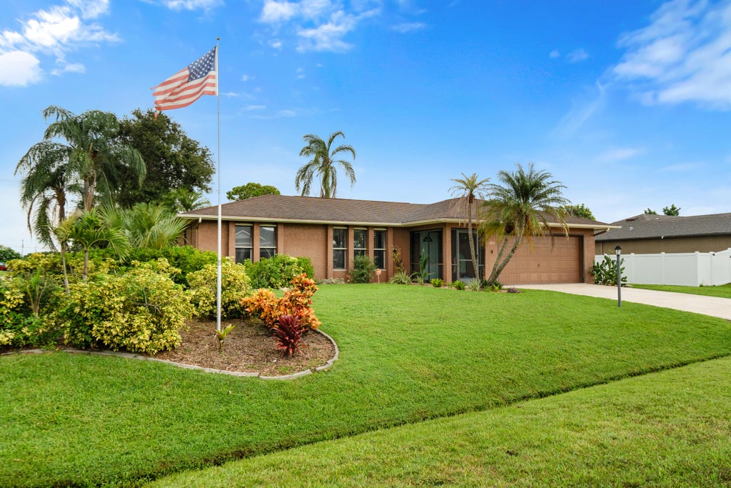 Photo of 297 SW Grove Avenue, Port Saint Lucie, FL 34983 (MLS # B26079847)