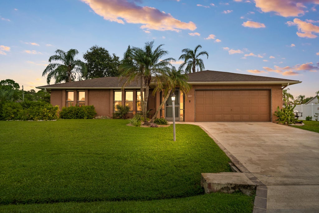 Photo of 297 SW Grove Avenue, Port Saint Lucie, FL 34983 (MLS # B26079847)