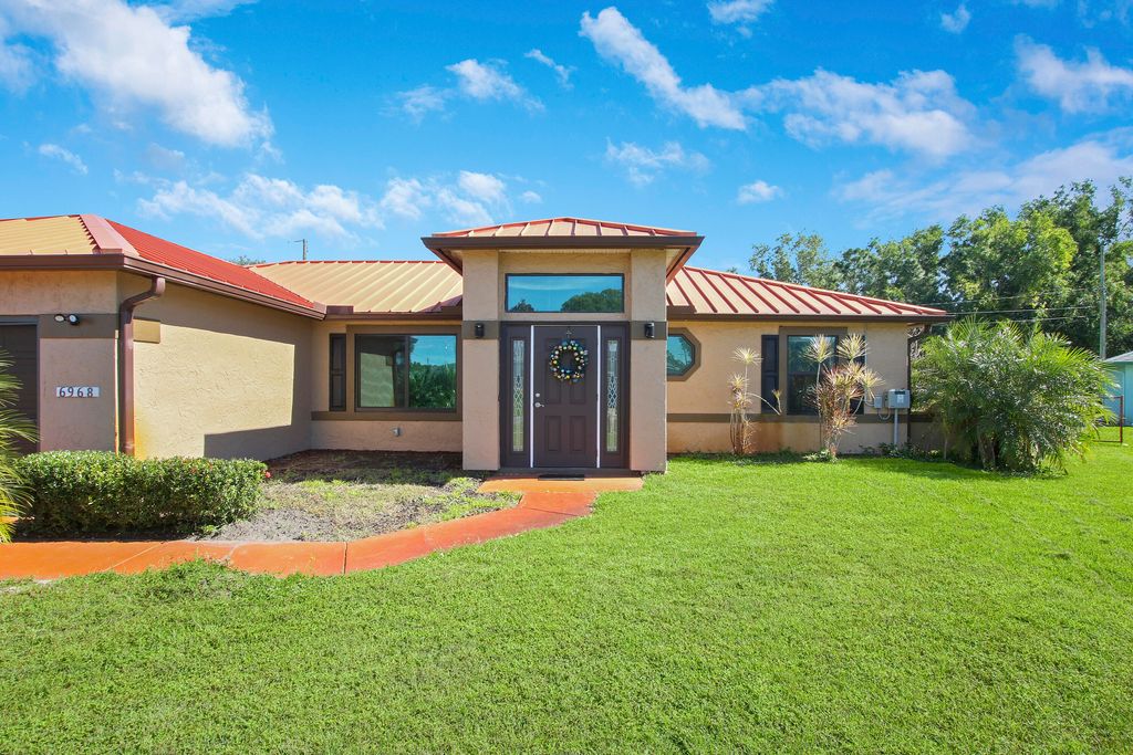 Photo of 6968 NW Hartney Way Way, Port St Lucie, FL 34983 (MLS # R10772592)