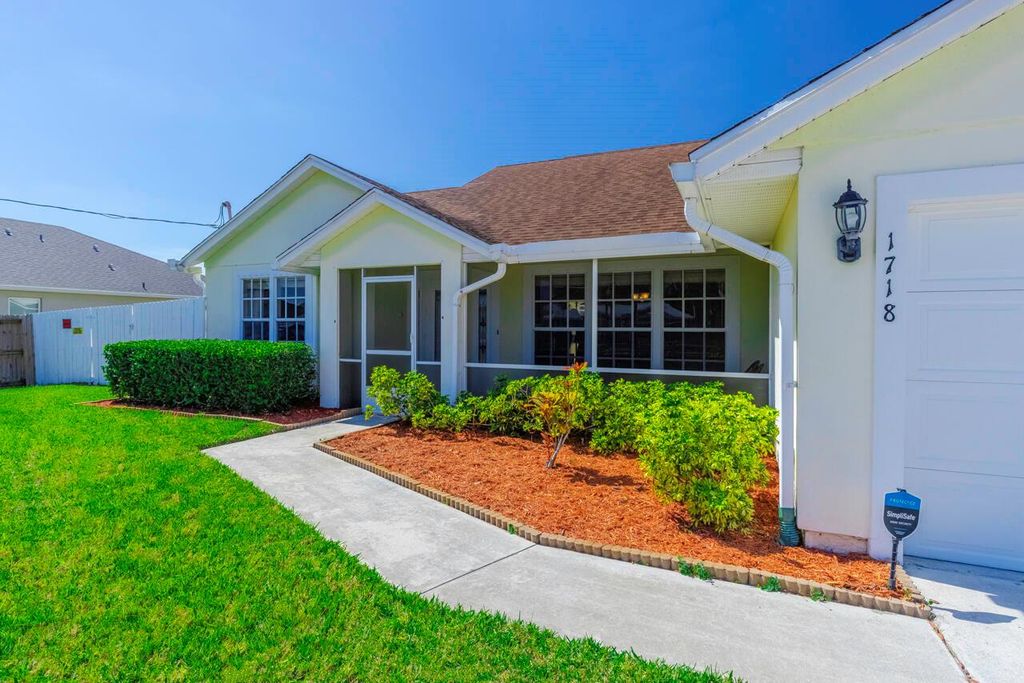 Photo of 1718 SW Boeing Street, Port Saint Lucie, FL 34953 (MLS # R10964056)