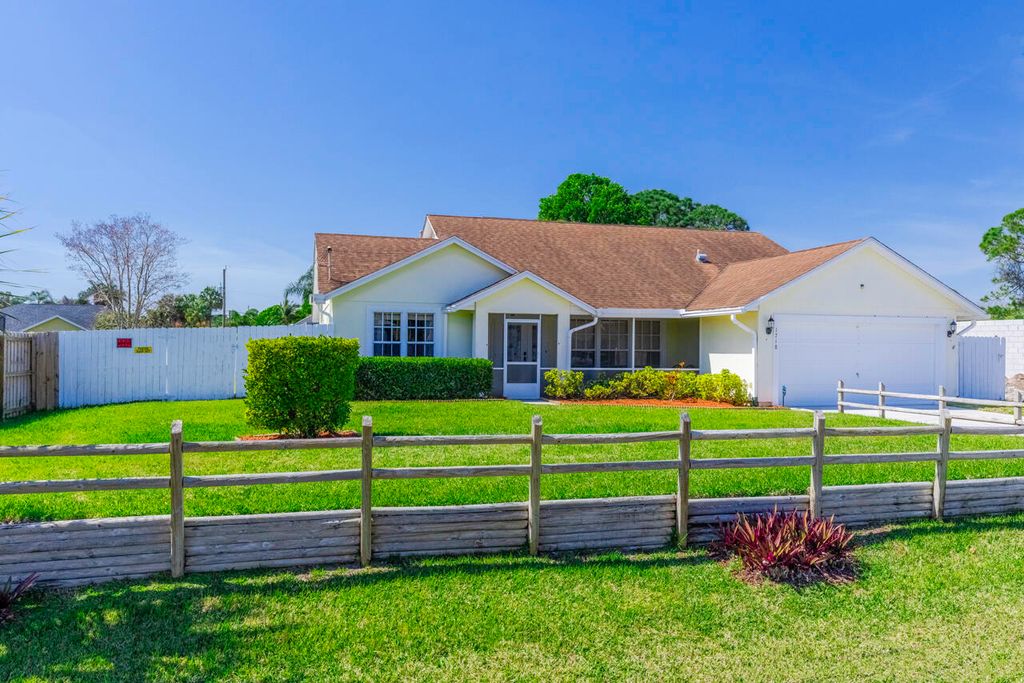 Photo of 1718 SW Boeing Street, Port Saint Lucie, FL 34953 (MLS # R10964056)