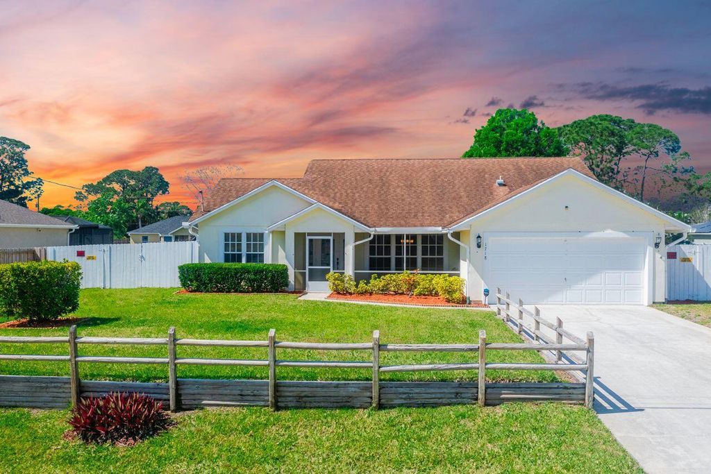 Photo of 1718 SW Boeing Street, Port Saint Lucie, FL 34953 (MLS # R10964056)