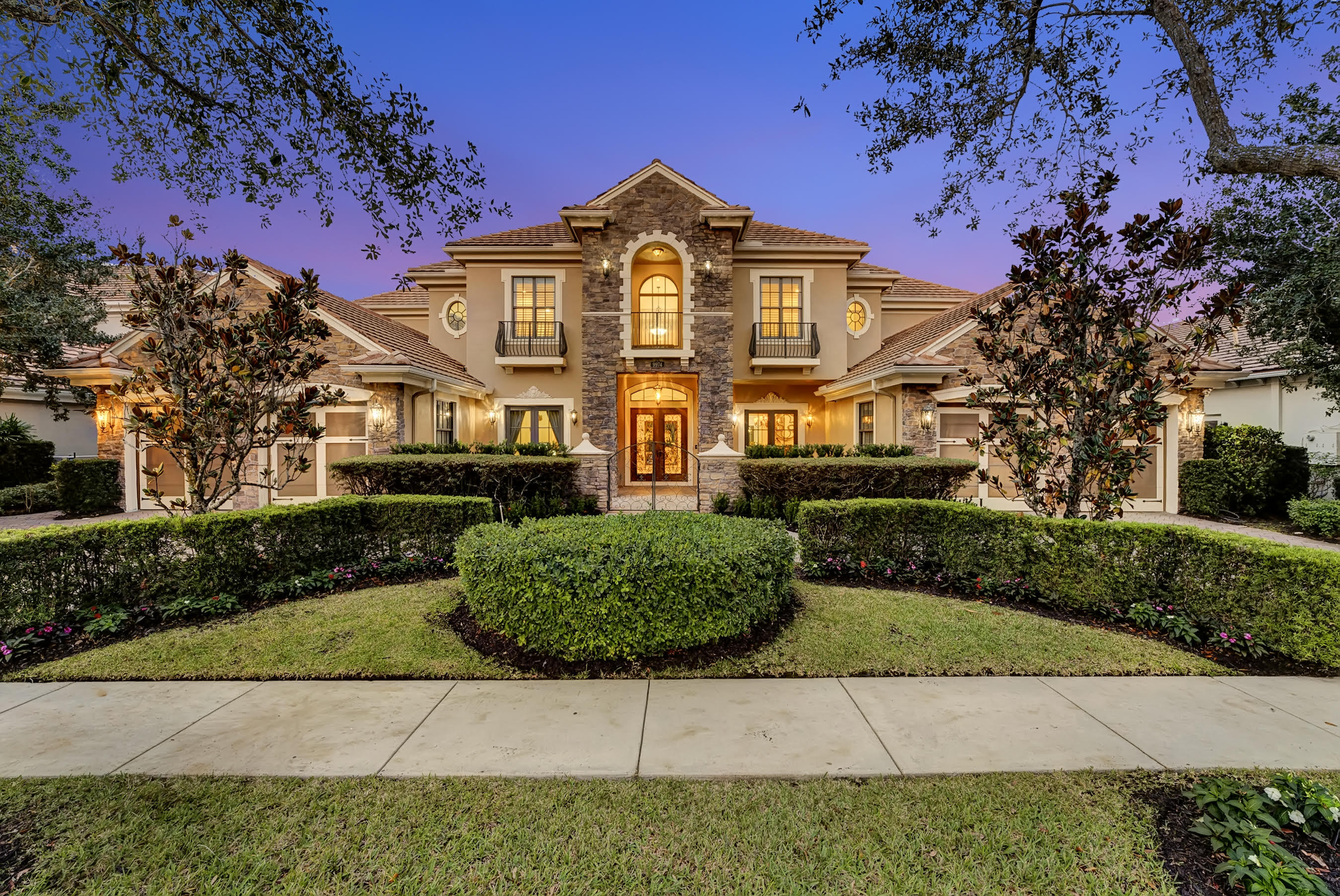 $400,000 less than the closest CLOSED comp in the community!!! This sprawling estate offers a timeless and elegant design. One of the largest model in Equus. This is the Eccelstone original builders model with over 600k in upgrades & custom finishes. This home is situated on lushly grounds abutting a paddock.  Horses are welcome in this Community. Large custom gourmet kitchen, marble and wood flooring, a  downstairs master suite, a game room with media library and built ins, a wet bar, custom design ceilings, exquisite finished details which include 7.5'' crown molding & baseboards, a huge grand main suite with a walk out balcony, all main level rooms open to the gorgeous pool and deck area, impact windows, a summer kitchen and a heated pool and separate spa all situated on apx 1/2 acre.