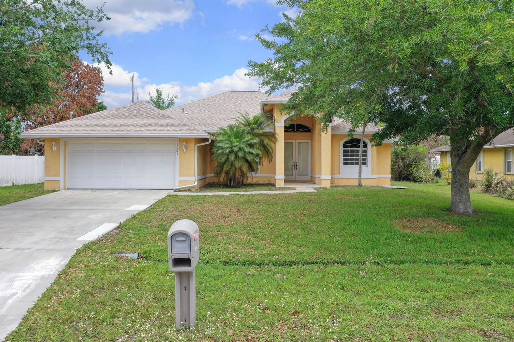 Photo of 1961 SW Delmonico Avenue, Port Saint Lucie, FL 34953 (MLS # B26019433)