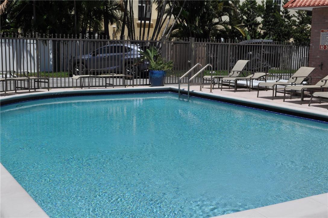 Updated 1BR/1BA condo at La Cancha in Victoria Park! Spacious and open floor plan with slate-like smooth tile throughout, crown molding and plantation shutters. Modern kitchen with pendant & accent lighting, euro-style cabinetry, granite counter tops and stainless appliances. Bedroom suite features a wall of French doors separating the living area, giving the apartment an even larger feel, and a spa-like bathroom (accessible from both living area and bedroom) which includes a shower with seamless glass enclosure, pebble floor, rain & hand held shower heads and modern vanity sink. Walk-in closet has been meticulously outfitted to maximize storage. Impact windows keep your sanctuary safe, quiet & cool. Very well run complex ideally located adjacent to Holiday Park & minutes to Las Olas!