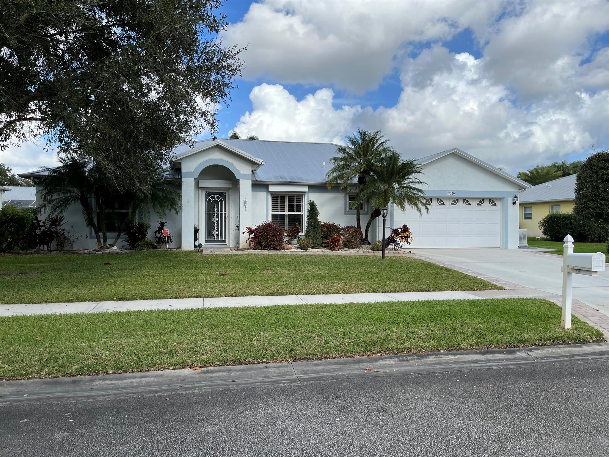 Beautifully updated 3 bedroom 2 bath home with office and attached 2 car garage in the desirable Cypress Lake Association in Vero Beach. Tile floors throughout main areas and master, with carpet in spare bedrooms. Master bath has zero entry shower and dual sinks. Plantation shutters. 1 enclosed patio with tv and a portable air conditioner, and another large screened in patio. Outdoor shower. Comes with a whole house generator that should last about 7 days. Roll down shutters for full hurricane protection and metal roof in 2014. This place is solid. Landscaping included.