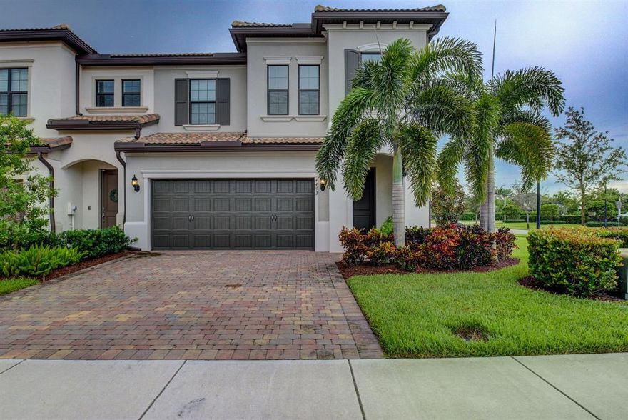 Could this be the best lot in the neighborhood?  Corner unit with lake view just across from the clubhouse.  Tons of upgrades including:  lighting, tile floors, eight foot doors, smooth-finish walls and impact glass throughout.  A cozy retreat just seconds from the turnpike with easy access to everywhere.