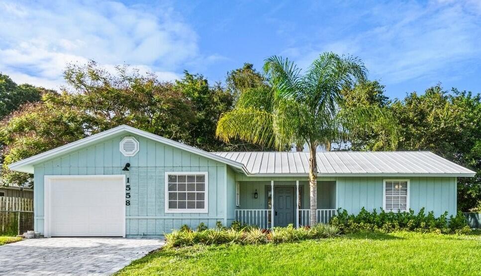 3/2 Single Family. Beautifully updated 3 bedroom, 2 bath home in the heart of Port St Lucie! New, eat-in kitchen featuring white, shaker cabinets, quartz counters and new stainless steel appliances. Bright, updated bathrooms. This home boasts both a living room and spacious family room with tons of light. French doors off the family room and master lead to a large screened patio to enjoy the outdoors. Beautiful, new laminate flooring throughout living areas and new carpet in bedrooms. Freshly painted inside and out. Huge back yard with storage shed. Beautiful, new paver driveway. Home has been converted from septic to sewer. Wonderful neighborhood close to shopping, entertainment, great schools and all Port St Lucie has to offer! Do not miss this beautiful home!