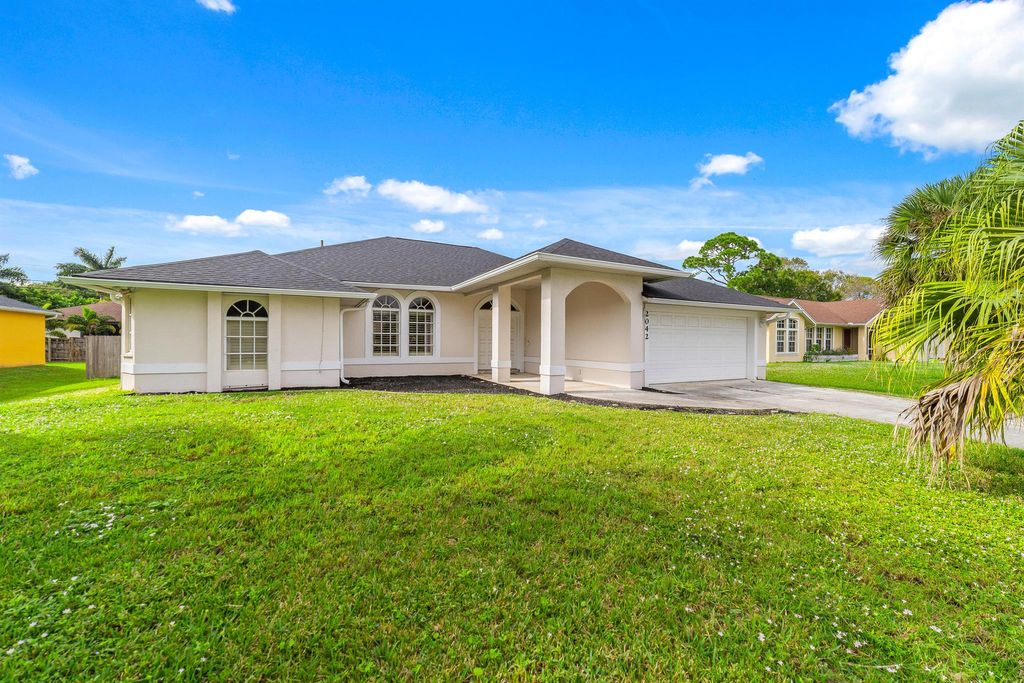 Photo of 2042 SW Capeador Street, Port Saint Lucie, FL 34953 (MLS # R10939608)