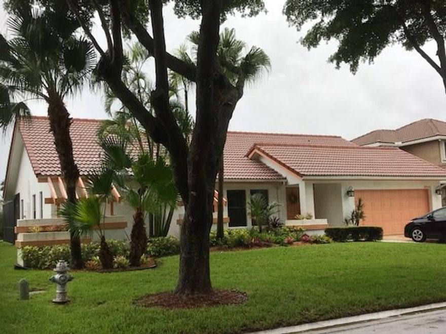 This Magnificent Home located in Coral Springs features 4 Bedrooms, 3 Full Baths, Pool and Water. Over 2200 Sf of Air Conditioned Living Space. Large, Open kitchen boasts wood cabinets and granite counters. Vaulted ceilings. Split bedroom plan. Living room. Dining Room. Breakfast room. Family room. Screened patio/ pool overlooking wide canal. Beautiful views. Perfect for entertaining. Two car garage. Great family neighborhood. Low HOA fees. New roof  installed in 2005.