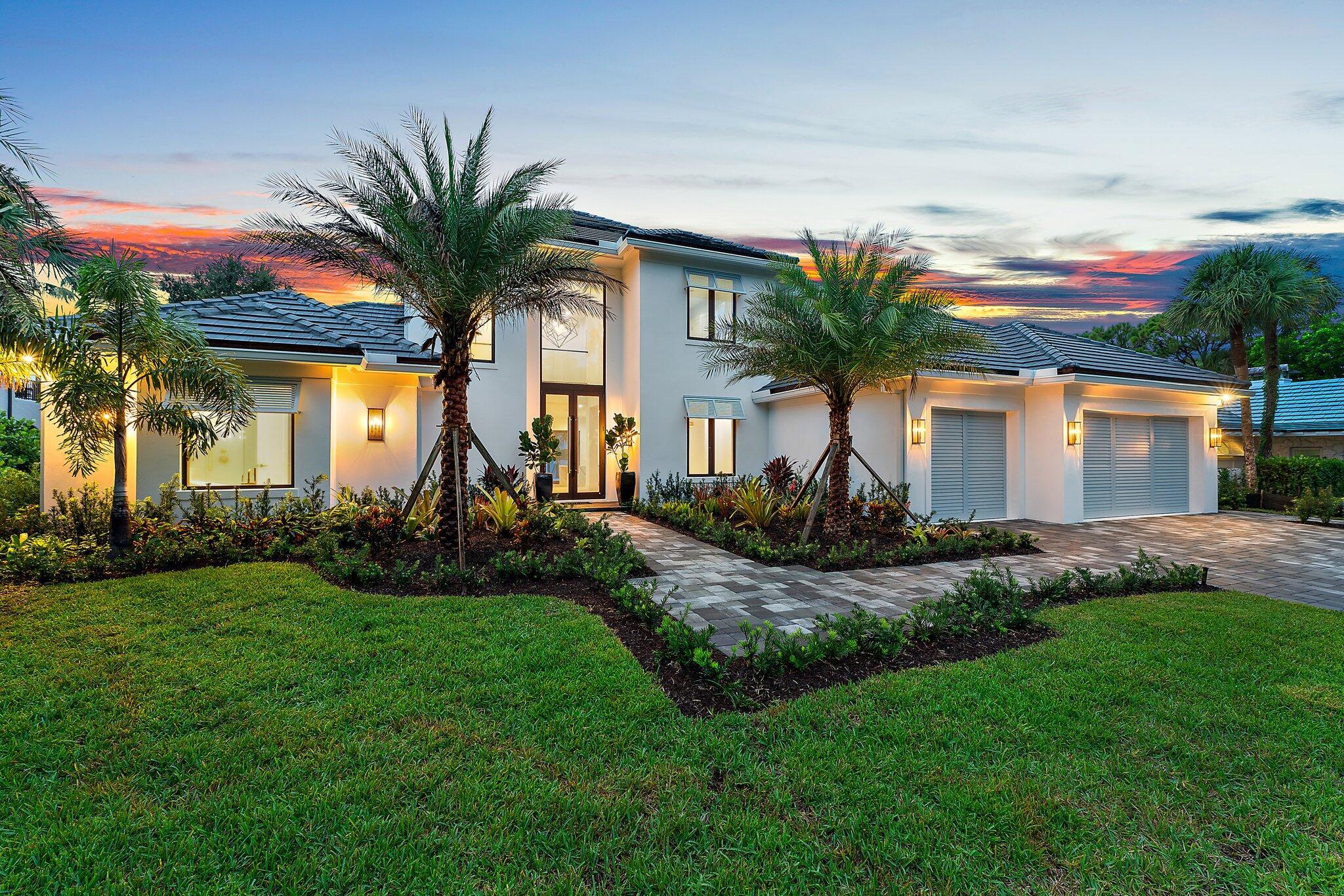 Introducing an elegant Bermuda-style custom residence, perfectly nestled in the charming Bay Harbor neighborhood, a serene enclave of just 15 homes with only 9 being located on the waterfront within the quaint Village of Tequesta. This exquisite 5-bedroom, 6-bath home boasts over 100 feet of frontage on the scenic, historic Loxahatchee River, offering breathtaking wide-water views from every room. As you approach, an elegant paver driveway and walkway guide you to a fabulous 2-story glassed entryway, bathing the home in natural light. In the main living area, you will find more spectacular views and a stunning wet bar for the entertainer. Adjoining the family room, a spectacular chef's kitchen is equipped with top-of-the-line appliances and Downsview Cabinetry,