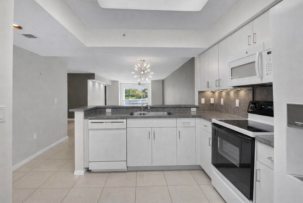 Photo of 5842 Crystal Shores Dr #205, Boynton Beach, FL 33437 (MLS # B26000690)