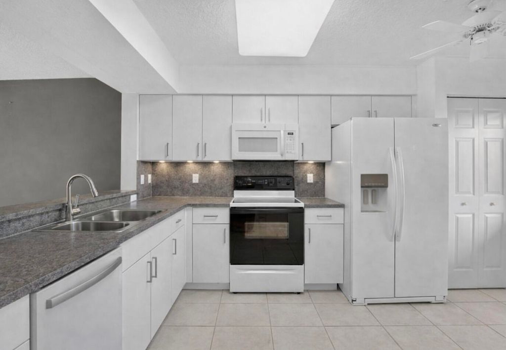 Photo of 5842 Crystal Shores Dr #205, Boynton Beach, FL 33437 (MLS # B26000690)