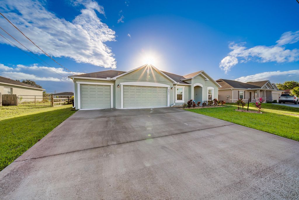 Photo of 4631 SW Athena Drive, Port Saint Lucie, FL 34953 (MLS # R10891403)