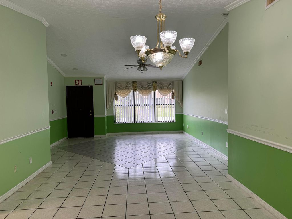 Photo of 450 SW Violet Avenue, Port Saint Lucie, FL 34983 (MLS # R10966388)