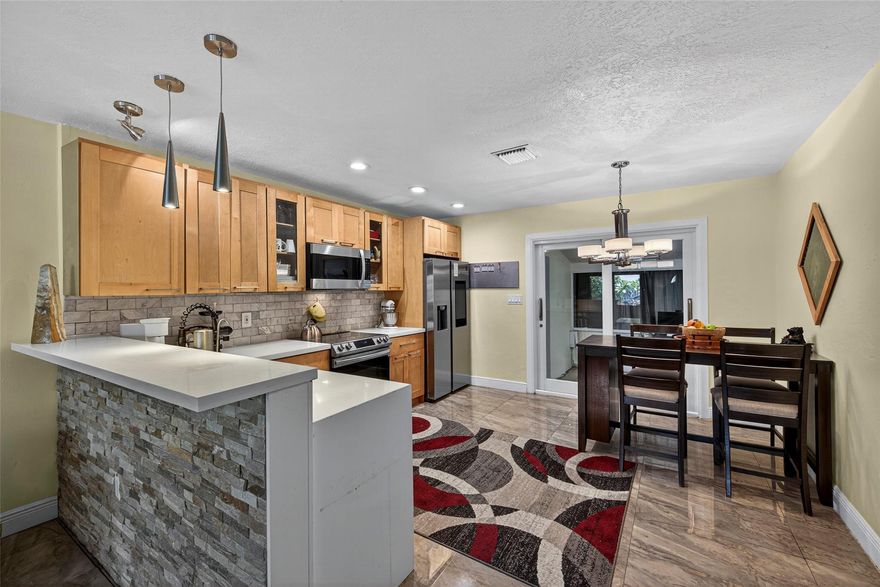 East Wilton Manors 2 bedroom, 2 bathroom Villa. Perfect Starter Home Properly Priced! Impact Windows and Doors, 2013 Roof, 2021 A/C, Water Heater, Appliances and Tile Flooring in main living areas. Spacious living area, Open Kitchen with bar seating, Quartz counter-tops and wood cabinets. Two Master Suites with Updated Baths and Plantation Shutters. Covered Front Entry, large Screened-In Patio, Laundry/Utility Room, and Privately Fenced Landscaped Garden Area, Spacious paver driveway accommodating 2 cars comfortably.  Updated Electrical Wiring and Panel Box. Central Location A Short Distance to Wilton Drive, the Beach, Downtown Fort Lauderdale, Shopping, the Airport and More!