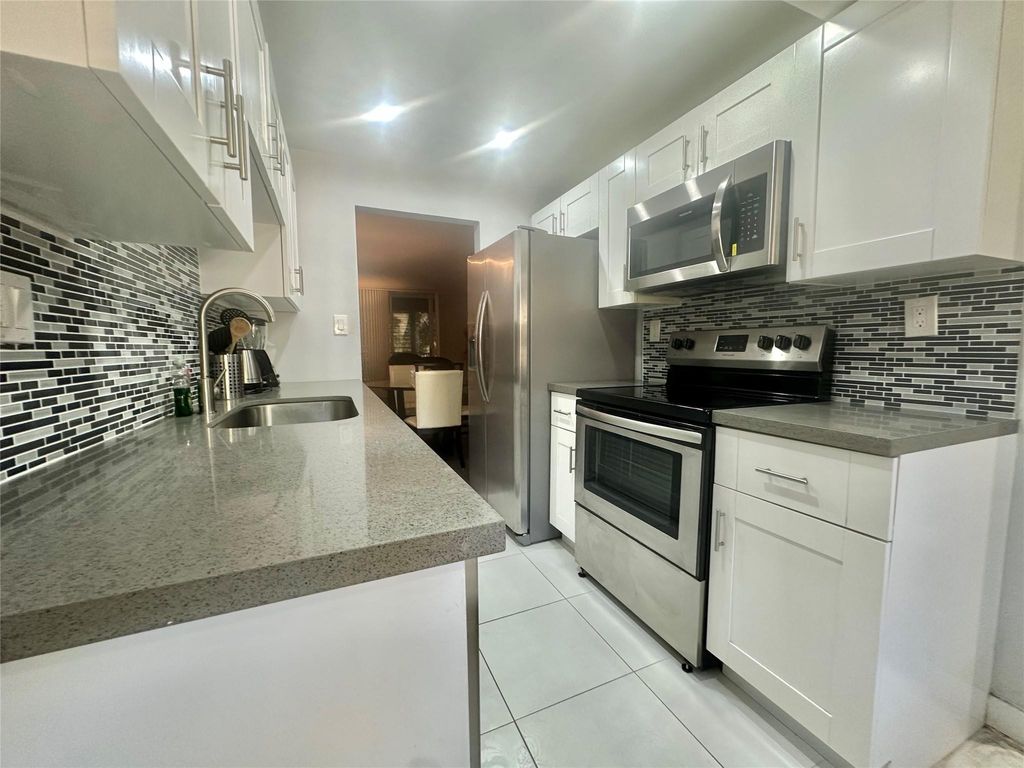 Photo of 3341 NW 47th Terrace #306, Fort Lauderdale, FL 33319 (MLS # F10554298)