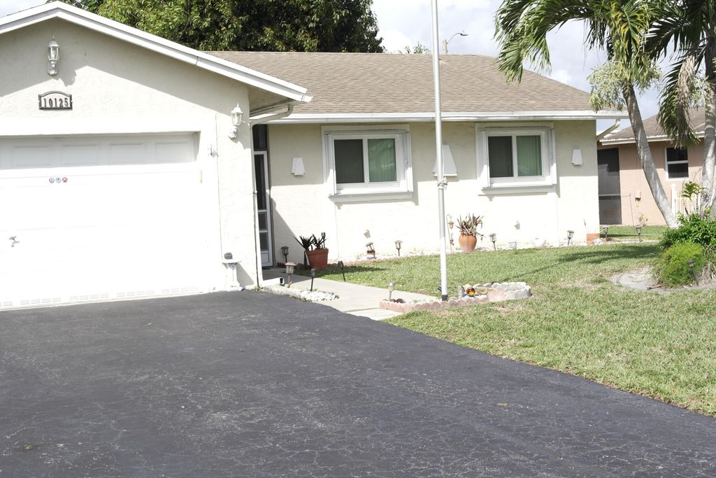 Photo of 10125 NW 71st Street, Tamarac, FL 33321 (MLS # B26012297)