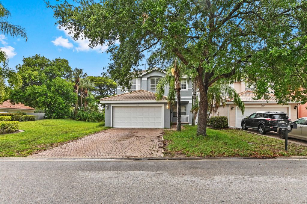 Photo of 5049 Starblaze Drive, Greenacres, FL 33463 (MLS # B26020116)