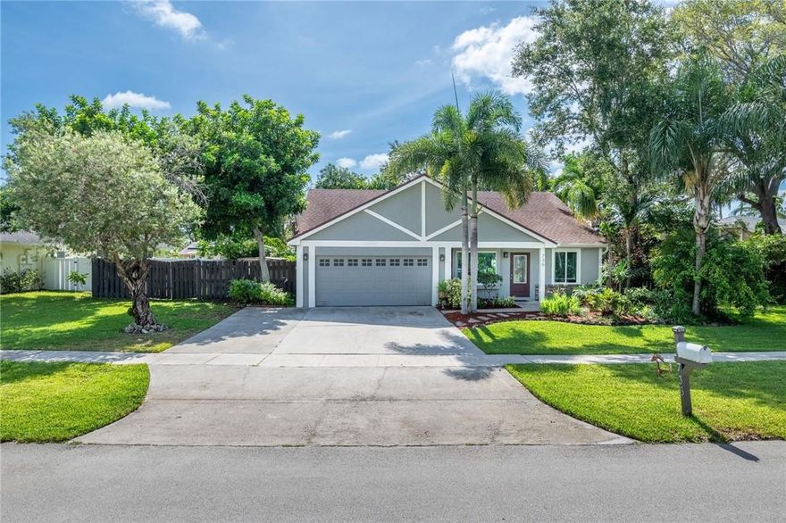 Awesome curb appeal for this 3/3 Custom Pool home situated on oversized fenced lot with gorgeous plants and trees to add to the beauty of yard and privacy. Pool and Deck rebuilt Jan 2023 including Diamondbrite and coping replacement!! Nov 2022 New Impact Glass throughout minus two sliders that have accordion shutters. Newer ac 2018/2019.  Kitchen appliances approx. 5 years new. Spacious Secondary Bedrooms. Garage was converted to "fun room" and still has plenty of room for storage. Screened in patio off pool and Master Bedroom which offers shade and zen like vibes surrounded by blooming orchids.  Tile and vinyl flooring in main areas and bedrooms. Extended driveway. Low association of $180 for the year!!!  Zoned for A+ schools of Weston.  Great location to walk to retail and public parks.
