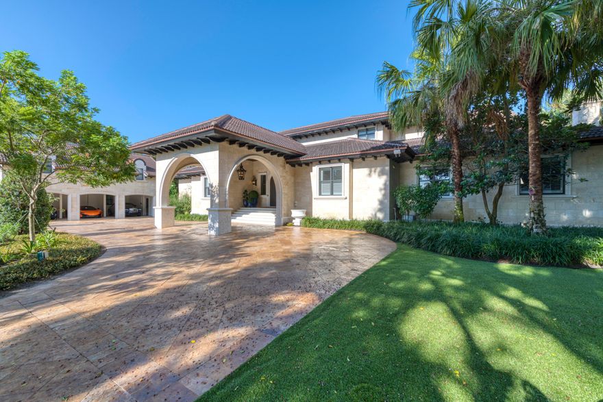 Inspired & handled by a multitude of custom craftsmen, designers and decorators in great harmony, this residence has undergone over three million dollars of exquisite changes to provide for an unparalleled waterfront lifestyle. The expansive home entrance presents a Dominican Coral facade, a foyer and formal living room with Ibiza Marble floors, Cast Stone molding, Schonbek Chrystal chandeliers & sconces, 18th century Limestone Wellhead, Gold Leaf trim & Coffered two story ceilings opening onto the outdoors, and a sweeping Wrought Iron banister guiding the staircase to the second floor. The southern wing, with the casual living configuration, has a custom built kitchen by Officine Gullo in Italy & shipped here for installation, a walk in Butler's Pantry, Quartz counter tops...(click more) ...Edgar Berebi nickel drawer knobs and pulls on Solid Wood cabinets, Tongue & Groove ceiling, Gaggenau double fridge, built-in Miele coffee/espresso machine, 412 bottle climate controlled wall wine cellar, Restoration Hardware chandelier & ceiling fans, Cast Stone fireplace in the casual eating area & family room, Sonos surround sound and Wood shutters. This portion of the home extends onto a masterpiece "Solarium" with multiple functions. Whether enjoyed as a formal dining room, an entertainment venue, a friends' get together, or family evening to take in the indoor/outdoor living, it has been finished with Hand Painted walls, a Dome LED lit ceiling with handpicked & applied Marble fragments and Schonbek Crystal chandelier & sconces. The northern wing, while welcoming you with Roberto Cavalli flooring, Cast Stone columns & archways, Groin hand painted ceilings, hosts the movie room, a guest/nursery suite, office and the master quarters. The owner's private abode is a home in itself with Groin two story gold leaf painted ceiling, Limestone wood burning fireplace and Schonbek Crystal chandeliers & sconces. The master bathroom opens to a Custom Limestone Kohler tub, Mosaic flooring, walk in Calcutta marble Steam feature shower, Michonne Grey Limestone countertops, custom cabinetry, Edgar Berebi handles encrusted with Swarovski crystals, Silver ornamental leaf Porcelain sinks with Swarovski Crystal handles and drain covers. The "piece de la resistance" here is the two floor custom dressing room with a Center Display Island, a spiral Aluminum Staircase, coffered ceiling, his & her safes with watch winders, mirrored wood custom cabinetry, Edgar Berebi handles encrusted with Swarovski crystals & Schonbek lighting come together. Atop this wing is a private & secluded library that would also be used as a secondary office or even a "zen" room away from it all. Upstairs, two guest suites with wood floors and a bathroom occupy the southern part while another guest suite with wood floors and its bathroom occupies the northern part. An entire guest quarters with a living area and kitchen was also built above the garage to provide for even more spacious accommodations. Overall, the entire Florida Waterfront Estate comes alive outside once entering the Gated compounds, welcomed by an impressive Banyan tree, a Marble circular driveway, manicured front yard surrounding a front Fountain, an oversized Playset on turf and side yard secondary Fountain, all accompanied by lighting, Sonos sound system, Security cameras and Wi-Fi extenders. Finally, the fulfillment is completed by the truly impressive backyard finished with Alaskan Marble decking. Offering an infinity pool with hot tub, outdoor kitchen, overhead covering for dining & entertaining and sunken lounging area with a fire pit, this side lets you enjoy the outdoors or head out onto your dock with two lifts and ample space for "water toys" (16,000 pounds for the boat lift & 9,000 pounds for the jet skis' lift).