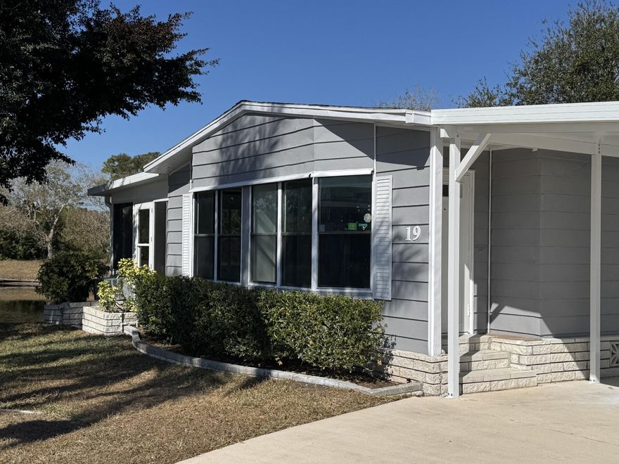 6 MONTHSOF FREE LOT RENT FOR NEXT BUYER! This home is currently being Totally remodeled! New pictures will be coming soon. Do not miss this Rare opportunity to live on one of the best lots in this 55+ community! Located on a quiet cul-de-sac, this park-owned home at 19 La Villa Court, Fort Pierce offers breathtaking double lake views & exceptional outdoor living. Enjoy 2 large screened enclosures, both overlooking the water--perfect for relaxing, entertaining, or taking in serene sunsets. A new roof is currently being installed, providing peace of mind for the next owner. Inside, the home features new laminate flooring throughout, laundry inside, and expansive windows that allow for beautiful lake views from most rooms. Situated in the pet section, this home is ideal for animal lovers Low lot rent of just $879 for next buyer! Residents enjoy a full suite of community amenities including a clubhouse, swimming pool, shuffleboard, planned activities, and well-maintained common areas.