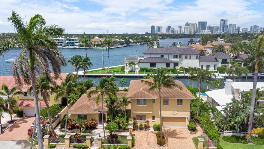 Imagine a luxurious residence where the vibrant flow of the Intracoastal meets the nostalgic flow of the New River, nestled in the sought-after South Las Olas area. This property offers a panoramic view that capture the essence of waterfront living. The expansive master suite, features spacious walk-in closets & separate baths, ensuring privacy & convenience. The proximity to the beach & shopping areas means leisure & amenities are just a stroll away. With 100 feet of dock space, maritime enthusiasts can indulge in the nautical lifestyle. This unique offering presents an opportunity to build a dream home while enjoying the comforts of a well-appointed temporary abode during the construction phase. It's a blend of immediate gratification and future potential, all in one exceptional package.
