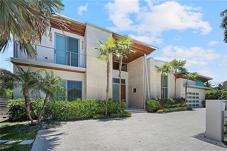 GORGEOUS LUX WATERFRONT CORAL RIDGE CONTEMPORARY HOME BUILT IN 2018.  100 FT WATERFRONT ON ONE OF THE WIDEST CORAL RIDGE CANALS.   THIS SPECTACULAR RESIDENCE FEATURES AN OPEN CONCEPT FLOOR PLAN WITH 2 PRIMARY SUITES (ONE UPSTAIRS ONE DOWNSTAIRS).  ALL BEDROOMS ARE ENSUITE.  ALL HIGH END FINISHES THROUGHOUT.  GOURMET KITCHEN WITH THERMADOR REFRIGERATOR, FREEZER AND GAS RANGE, SUB ZERO WINE FRIDGE AND TONS OF COUNTER SPACE AND STORAGE.  TROPICAL BACKYARD FEATURES OVERSIZED COVER LANAI WITH BUILT IN GRILL, HEATED POOL WITH SPA, PROFESSIONAL LANDSCAPE LIGHTING AND PLENTY OF PLACES TO ENJOY SOUTH FLORIDA’S PERFECT WEATHER.