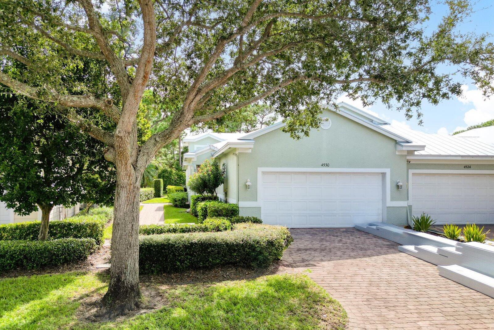 Nestled in the highly sought-after, gated community of Willoughby Cay in beautiful Stuart, this immaculately maintained villa is a true gem. Featuring a brand-new metal roof and gutters (installed in 2024), this home offers worry-free living with its exceptional care and attention to detail.Step outside to your private oasis - a sparkling pool, fully enclosed with a newer pool enclosure (installed in 2023), and a refinished pool (2020) - ideal for year-round enjoyment. Custom blinds throughout the home add a touch of elegance, and accordion shutters offer added peace of mind.Featuring stainless steel appliances (installed in 2021). The laundry room comes with a convenient sink, and there's no shortage of closets and storage space throughout the home.