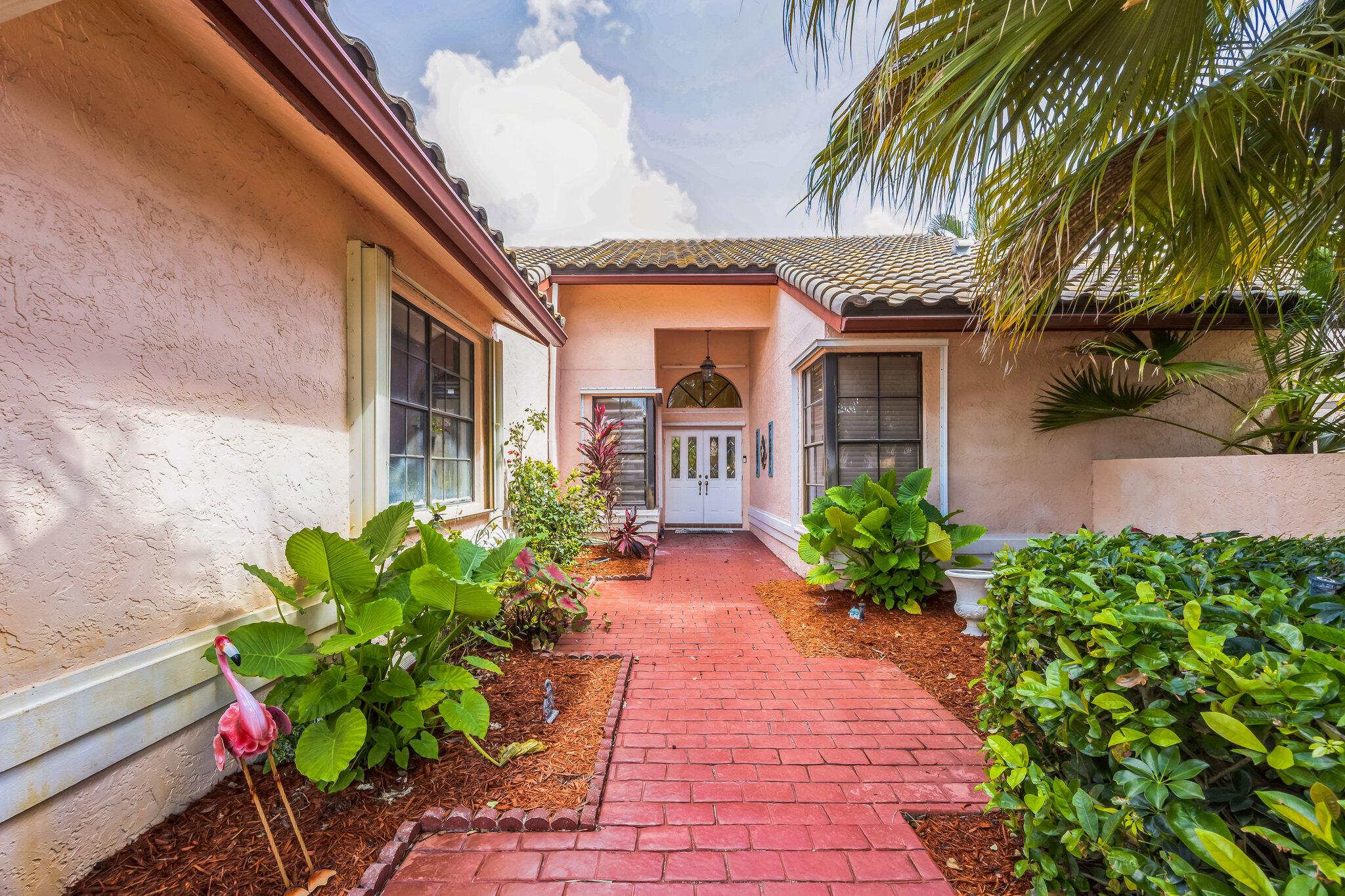 Gorgeous Updated 2 bedroom home in desired BOCA GREENS. Featuring WALK THRU FRONT ENTRY TO AN OPEN LIVING AREA LEADING TO A LUSHLY LANDSCAPED COVERED SCREENED PATIO, SPARKLING POOL OVERLOOKING A TRANQUIL LAKE. THE KITCHEN HAS CUSTOM WHITE WOOD CABINETS, GRANITE AND TOP-OF-THE-LINE STAINLESS APPLIANCES. LAUNDRY RM. MASTER BATH HAS JUST BEEN REMODELED WITH NEW CABINETS, MARBLE FLOORING, NEW TUB AND A SPACIOUS SHOWER. WALK-IN CLOSET PLUS 2 OTHER ACCENT MASTER HAS SLIDNG DOORS LEADING TO BEAUTIFUL POOL AREA. WINDOW GIVES YOU A SERENE VIEW OF THE LAKE. BEAUTIFULLY LANDSCAPED ATRIUM ACCENTS, NEW WOOD FLOORING IN DEN AND 3RD BED. GUEST BATHROOM WITH GORGEOUS TILED SHOWER, NEW VANITY NEWER HURRICANE SHUTTERS FOR EASY LOCKUP. THIS HOME HAS BEEN METICULOUSLY MAINTAINED. YOU MUST SEE IT.