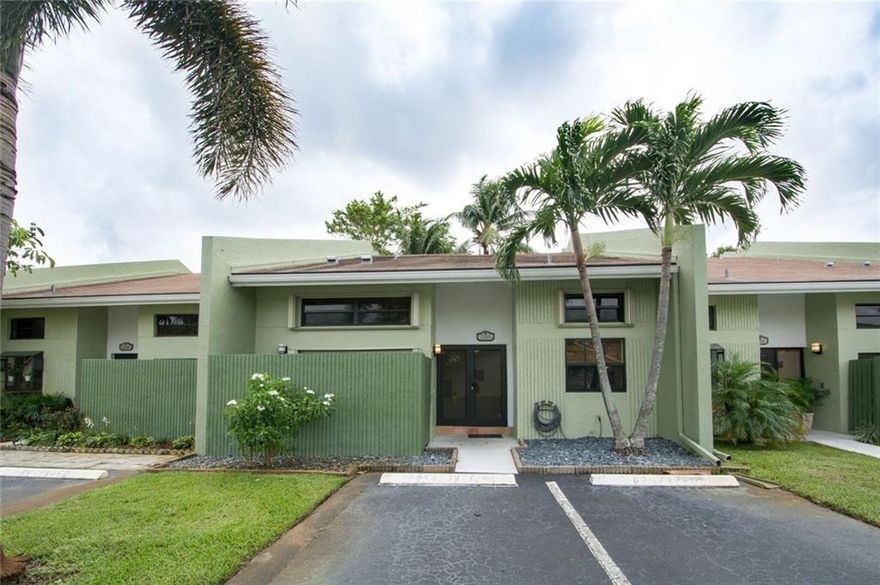 2 bedroom plus a bonus room and a Loft!  The bonus room could be used as a 3rd bedroom. Spacious, vaulted 25 foot high ceilings! Impact Windows and Impact Doors plus accordion shutters. Sleek kitchen with newer cabinets and granite counters.  Private, fenced patio perfect for entertaining!  Screened Patio plus an additional, Open Patio! 2 parking spaces directly at front door.