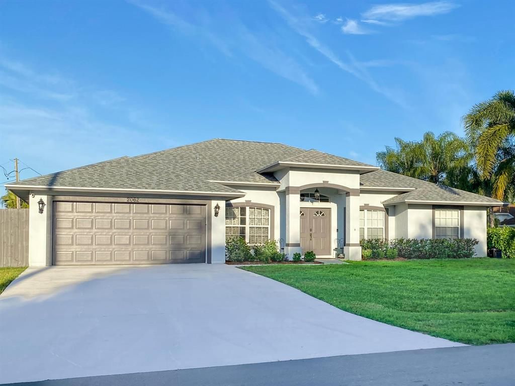 Photo of 2062 SW Sunglow Street, Port St Lucie, FL 34953 (MLS # R10877316)