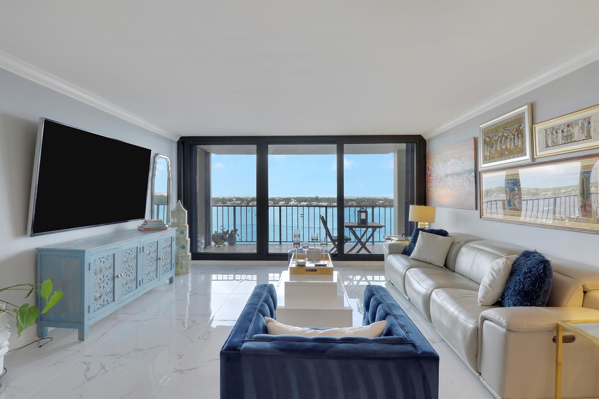 AMAZING WATER VIEWS from this newly renovated 2BR/2BA fully furnished condo in Old Port Cove. Light & bright space with beautiful finishes throughout. Kitchen features white cabinetry with quartz countertops, SS appliances and mother of pearl backsplash. Solid surface flooring throughout. Both bathrooms have been updated. Impact glass sliders. Large balcony allows for dining al fresco. Perfect spot to enjoy your morning coffee while taking in the spectacular intercoastal and ocean views. Building amenities include outdoor pool, fitness center, community room and 2-mile waterfront walking path. On-site waterfront restaurant and bar. 24-hour manned gatehouse and minutes to world class shopping, dining and airport. Don't miss this opportunity to enjoy waterfront living - call today!