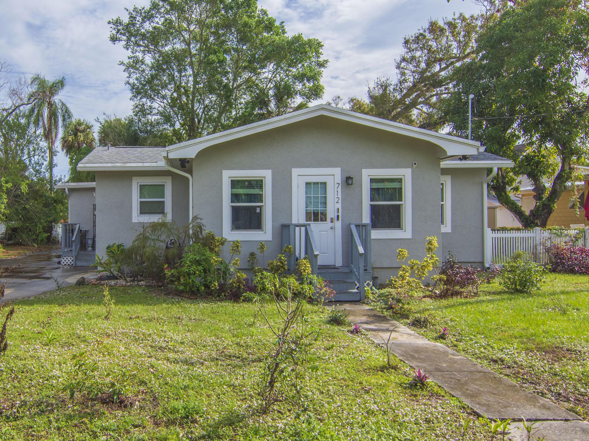 Located in historic Oakland Park on a quiet tree lined street with sidewalks, just minutes from the Peacock Arts District, Historic Downtown Fort Pierce, the Sunrise Theatre, Marina Square and the Downtown Farmer's Market. Fort Pierce Inlet and beautiful beaches are at your fingertips. Remodeled in 2021. Updated Plumbing & Electric. AC 2021, Roof 2018. Original Hardwood Floors, Impact Windows, Granite Countertops, Stainless Steel Appliances & Hood, Recessed Lighting, Large Walk-In Pantry. Open Floor Plan. Charming Front Room with Built-in Open Shelving. The fourth bedroom is huge, has endless possibilities and could be used as an additional family room, game room, craft room, fitness & yoga room, etc. Open Porch, Large partially Fenced Back Yard. 2021 Storage Shed. Fire Pit.