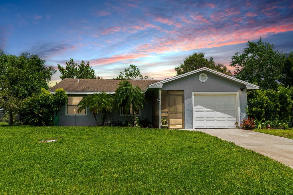 Photo of 1065 SW Dubuque Avenue, Port St Lucie, FL 34953 (MLS # R10913425)