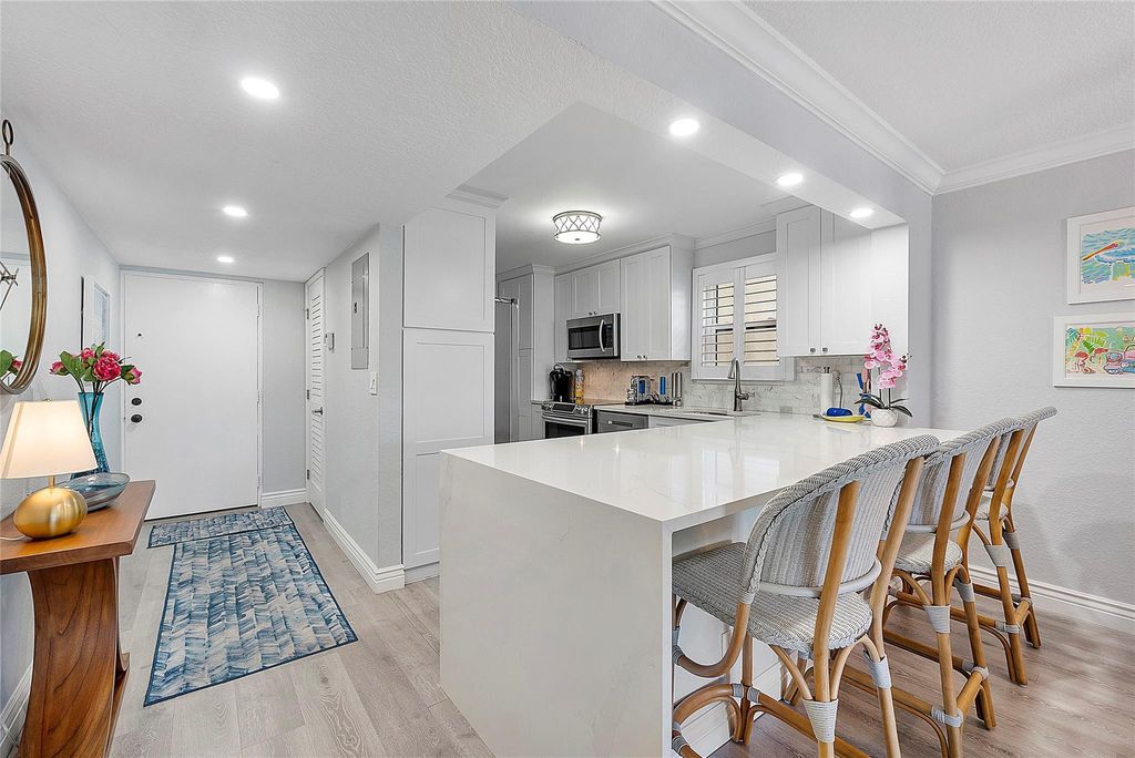 Photo of 2309 S Cypress Bend Drive #211D, Pompano Beach, FL 33069 (MLS # F10439287)