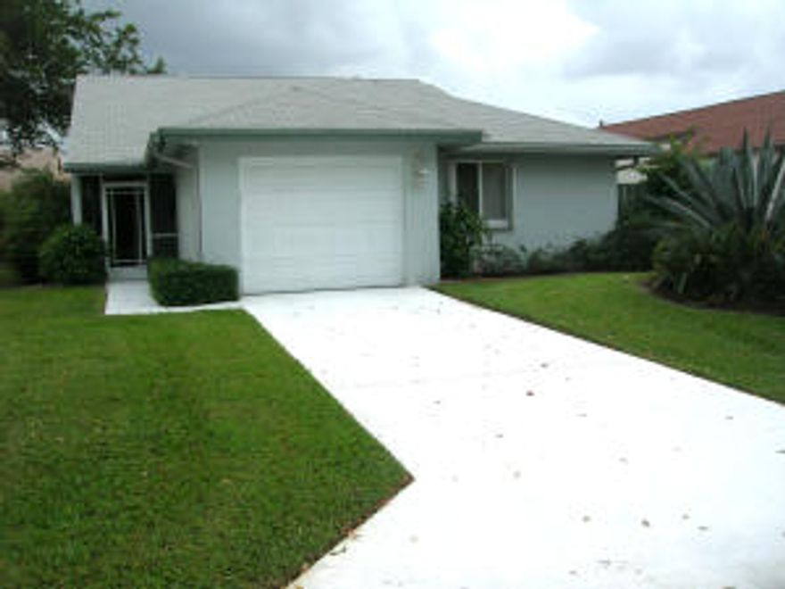 Bright and Airy is this Mint conditioned Patio home.  Featuring 2 bedrooms, 2 baths, Gorgeous Eat-In-Kitchen completely upgraded with granite Counters. Delightful Florida room overlooking a lushly landscaped garden, attached garage and Accordion Hurricane Shutters.Vaulted ceilings with Crown Moldings add to the openness of this gem of a home.  Set in a very active gated community featuring a Club house, Separate Theatre 5 Heated Swimming pools & 12 Clay Tennis Courts,  Come and join the fun.