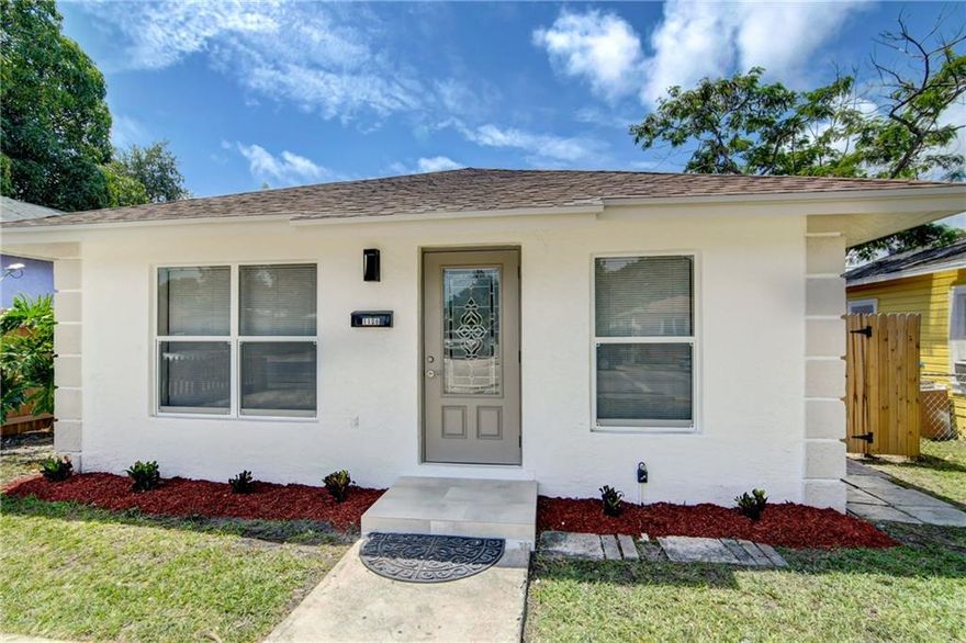 GORGEOUS NEWLY RENOVATED 3 BEDROOM HOME WITH PRIVATE FENCED YARD.  HOME HAS BEEN COMPLETELY REMODELED WITH HURRICANE IMPACT WINDOWS, BRAND NEW A/C SYSTEM, NEW WATER HEATER, UPGRADED ELECTRICAL, BRAND NEW LIGHT FIXTURES.  INTERIOR UPGRADES FEATURES BRAND NEW WOOD FLOORING THROUGHOUT, BRAND NEW KITCHEN WITH WHITE CABINETS, QUARTZ COUNTERS, CUSTOM BACKSPLASH AND STAINLESS STEEL APPLIANCES AND WASHER/DRYER IN SEPARATE LAUNDRY ROOM. OTHER UPDATES INCLUDE UPGRADED BATHROOM, NEW LANDSCAPE, FRESHLY PAINTED, INTERIOR AND EXTERIOR. LOCATION IS IN A NEWLY DEVELOPING NEIGHBORHOOD, EASILY ACCESSIBLE TO DOWNTOWN WEST PALM BEACH.  NO HOA. DON'T FORGET TO VIEW VIRTUAL TOUR!!!