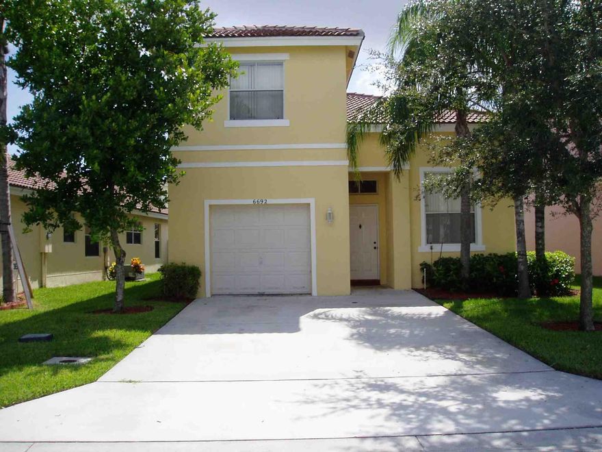 Welcome to the desirable family community of Winston Trails in west Lake Worth. Short distance to some of the best ''A'' rated schools in the county including Manatee Elementary and Park Vista High School.  Cathedral ceilings and balcony overlooking first floor. First floor master bedroom features a huge walk in closet. Wood and tile flooring throughout make cleaning easy. Kitchen features a breakfast bar, pantry and new Stainless Steel appliances just installed. Yard is fenced for privacy. Community amenities include manned guard gates, security patrol, pools, golf course, driving range, restaurant, tennis and playgrounds. High speed internet, cable TV and lawn included in maintenance fee.  Amazing opportunity, don't miss this one!  Get in before school starts again!