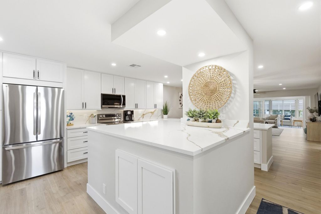 Photo of 1415 SW 27th Avenue #104, Delray Beach, FL 33445 (MLS # B26005218)