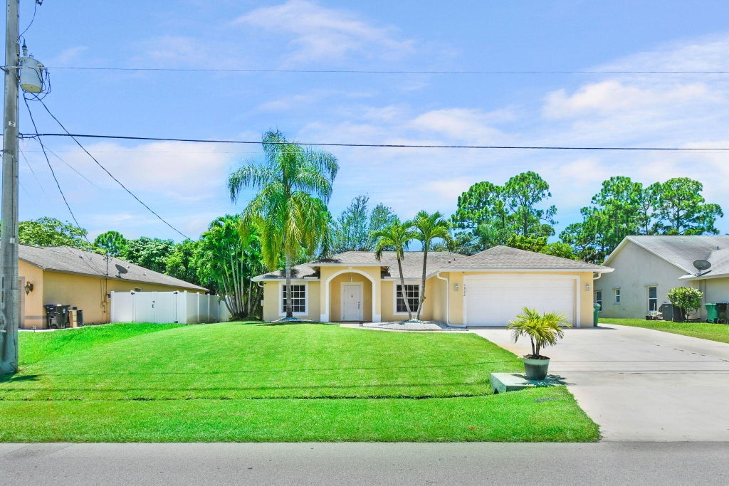 Photo of 1922 SW Janette Avenue, Port Saint Lucie, FL 34953 (MLS # R11001078)