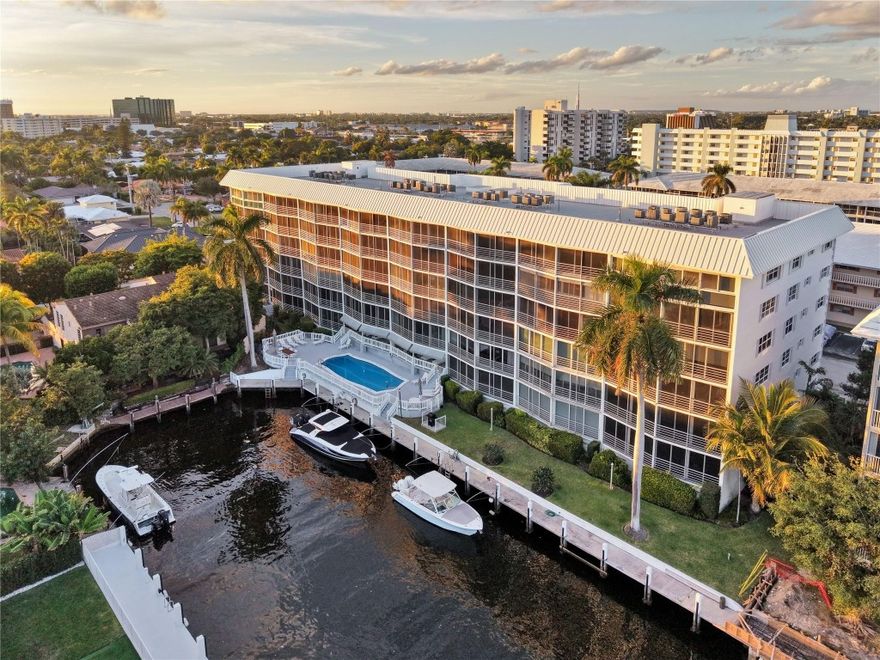 Wake up to water, light, and sea breezes at Winston House. This bright 2BD/2BA condo with 1,281 sq ft offers wide Intracoastal & pool views and a desirable dual primary suite layout for privacy and flexibility. Living areas are lined with wall-to-wall, floor-to-ceiling sliding windows that open to screened panels, bringing in natural light, sunrise views, and coastal air. Dock space currently available for owners, accommodating boats up to 40 ft ($4.40/ft; optional electric). Recent updates include a 2024 roof and brand-NEW appliances. Community features a waterfront pool, canal-side seating, and garage parking. No leasing and no pets per association. Ideally located steps from Coral Ridge Country Club and approx. 1 mile to the beach, with easy access to dining, shopping, and nightlife.